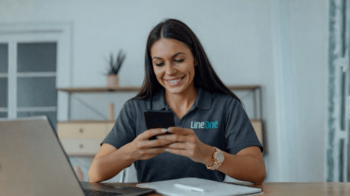 Business user managing calls with a VoIP phone system on a smartphone, representing modern business communication with LineOne.